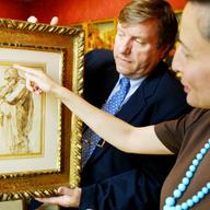 Curators examine a Michelangelo painting discovered in Yorkshire, England.